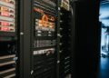 Rack of Bitcoin mining servers representing network hashrate