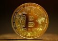 A single Bitcoin standing alone, representing solo Bitcoin mining