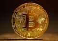 A single bitcoin coin representing digital currency, illustrating a beginner's guide to what Bitcoin really is